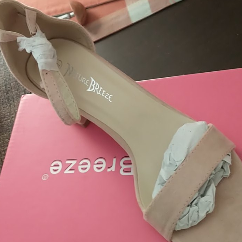 Pink/blush ankle strap sandals.